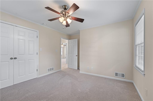 156 Ridgeway St, Winder, GA 30680 - unfurnished bedroom with carpet, baseboards, ornamental molding, and a closet