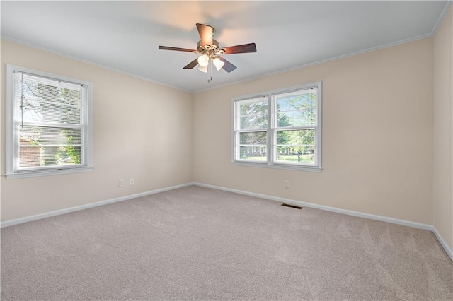 156 Ridgeway St, Winder, GA 30680 - carpeted empty room with healthy amount of natural light, baseboards, ornamental molding, and ceiling fan