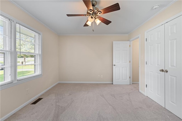 156 Ridgeway St, Winder, GA 30680 - unfurnished bedroom with carpet floors, crown molding, baseboards, and a closet