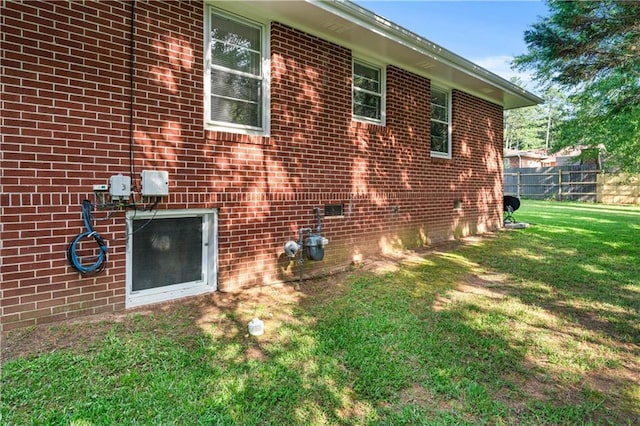 156 Ridgeway St, Winder, GA 30680 - view of side of home featuring a lawn and brick siding