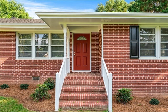 156 Ridgeway St, Winder, GA 30680 - view of exterior entry featuring brick siding and crawl space