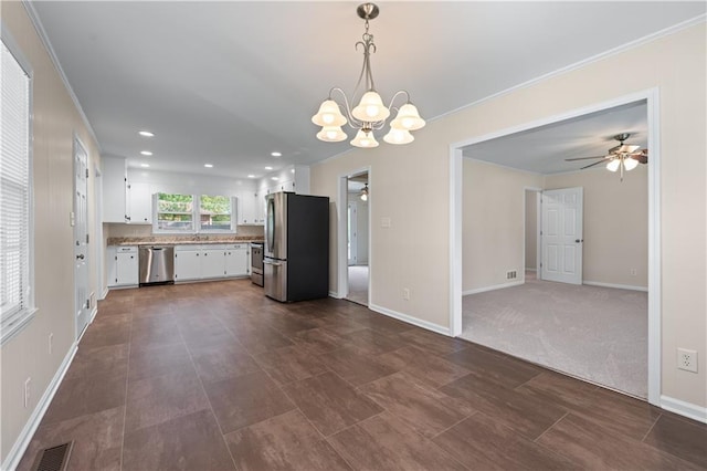 156 Ridgeway St, Winder, GA 30680 - kitchen featuring stainless steel appliances, white cabinets, crown molding, baseboards, and a ceiling fan