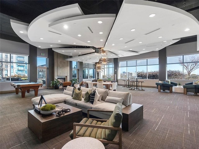 game room featuring a wealth of natural light, pool table, and dark colored carpet