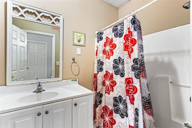 bathroom with vanity and a shower with shower curtain