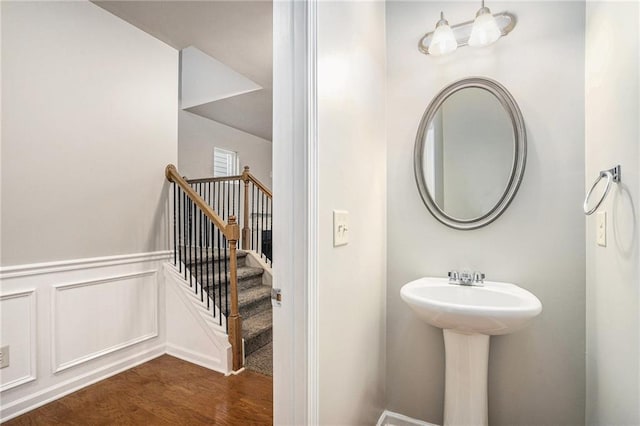 bathroom with hardwood / wood-style floors