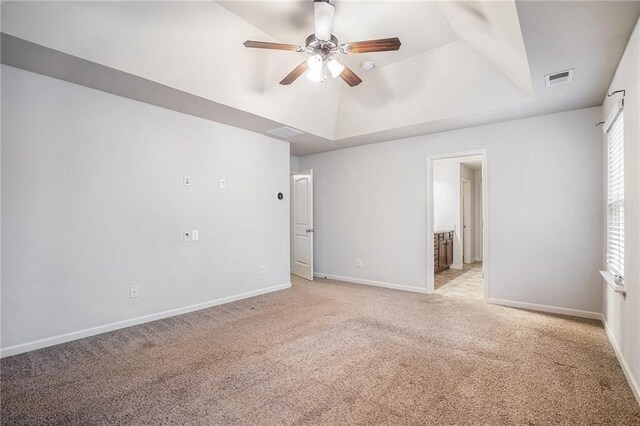 carpeted spare room with ceiling fan