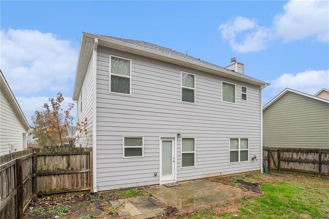 rear view of property featuring a patio