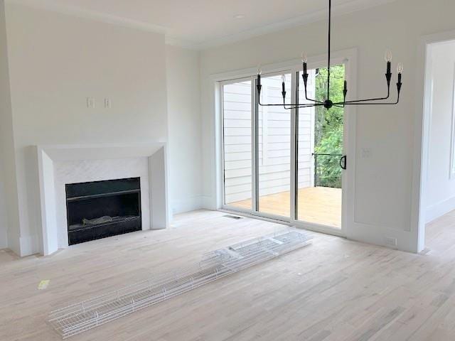 001 White St Unit 1, Marietta, GA 30060 - unfurnished living room featuring wood finished floors, a chandelier, a fireplace with flush hearth, and baseboards