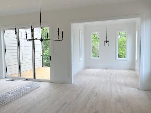 001 White St Unit 1, Marietta, GA 30060 - unfurnished dining area with wood finished floors, a chandelier, and baseboards