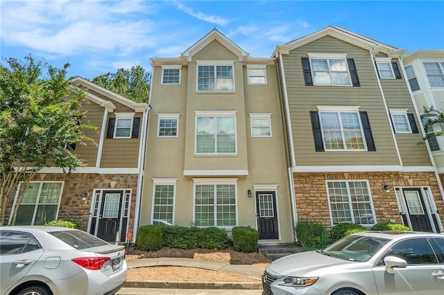 234 Riverstone Commons Cir, Canton, GA 30114 - view of property featuring stone siding and stucco siding