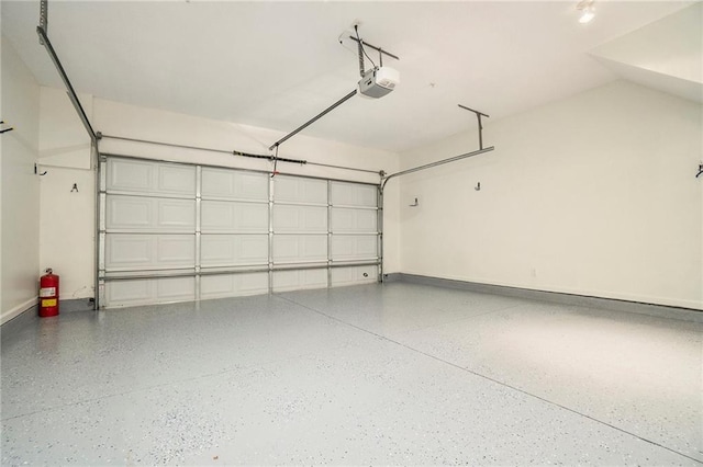 234 Riverstone Commons Cir, Canton, GA 30114 - garage featuring a garage door opener and baseboards