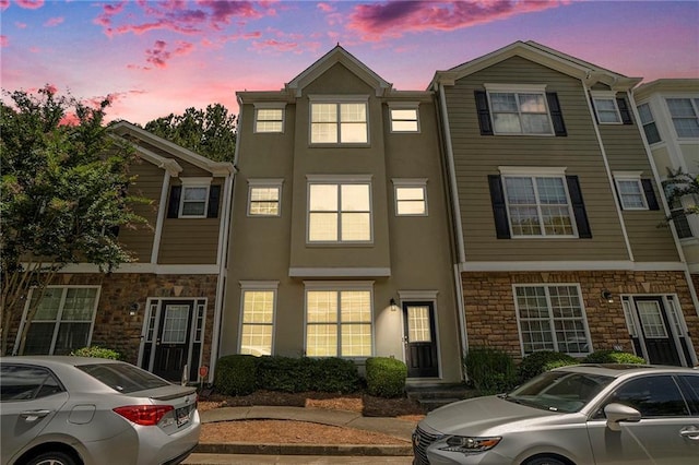 234 Riverstone Commons Cir, Canton, GA 30114 - view of property featuring stone siding and stucco siding