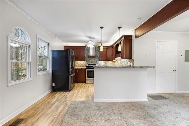 kitchen featuring ornamental molding, wall chimney exhaust hood, backsplash, and stainless steel appliances