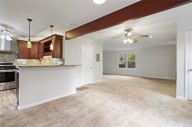kitchen with a ceiling fan, light carpet, stainless steel electric stove, and wall chimney range hood