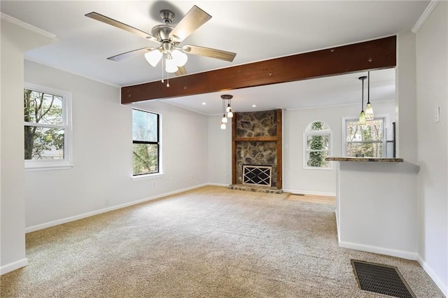 unfurnished living room featuring visible vents, light carpet, and plenty of natural light