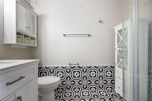 bathroom with toilet and vanity