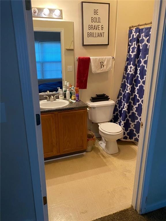 bathroom with vanity and toilet