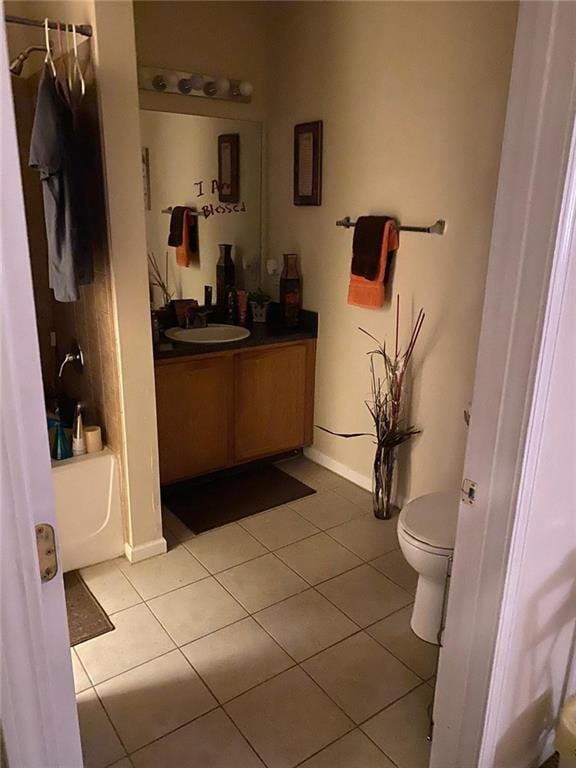 full bathroom featuring tile patterned floors, vanity, bathtub / shower combination, and toilet