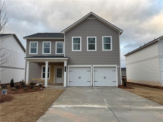 view of front of property with a porch and a garage