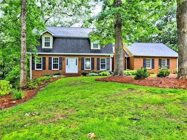 1257 Independence Way, Marietta, GA 30062 - dutch colonial with brick siding, a front yard, and roof with shingles