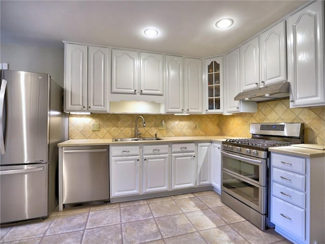 1257 Independence Way, Marietta, GA 30062 - kitchen featuring stainless steel appliances, under cabinet range hood, a sink, white cabinetry, and light countertops