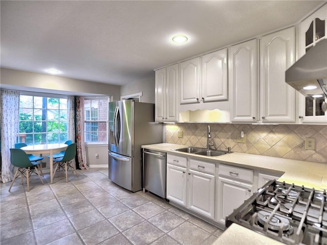 1257 Independence Way, Marietta, GA 30062 - kitchen with appliances with stainless steel finishes, a sink, light countertops, white cabinets, and backsplash