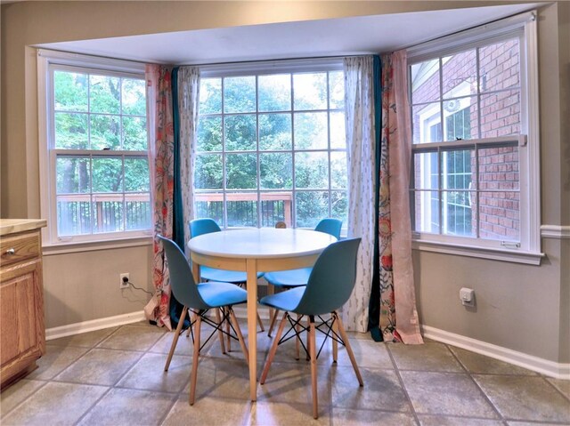 dining room with baseboards