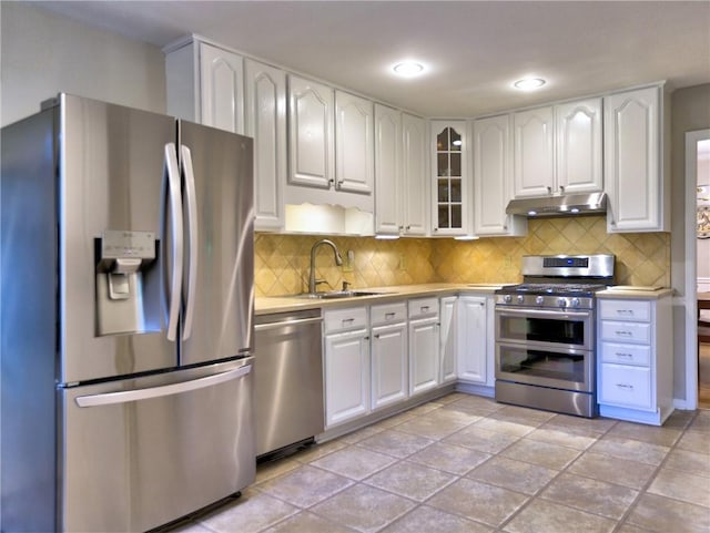 1257 Independence Way, Marietta, GA 30062 - kitchen with appliances with stainless steel finishes, under cabinet range hood, light countertops, white cabinetry, and a sink