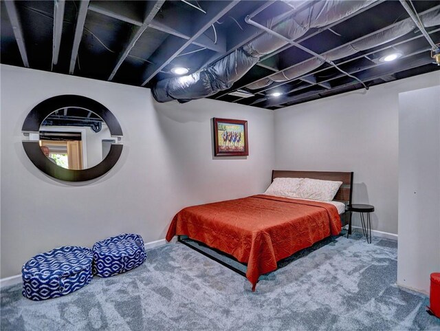 bedroom with baseboards and carpet flooring