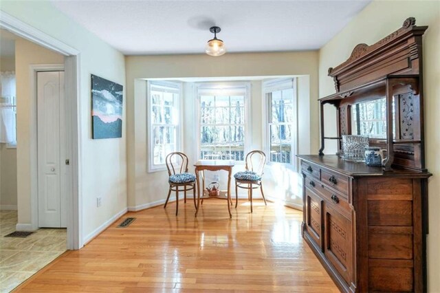 sitting room with light wood-type flooring