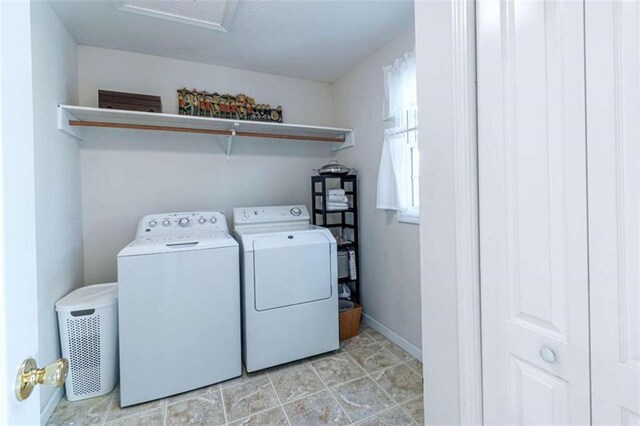 laundry room with washing machine and clothes dryer