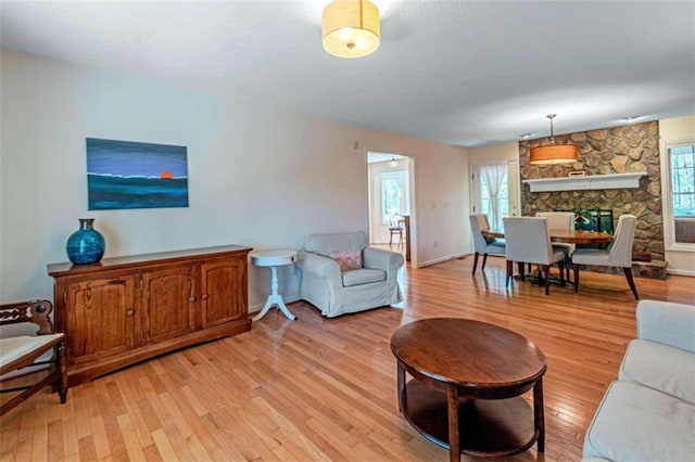 living room featuring a fireplace and light hardwood / wood-style floors