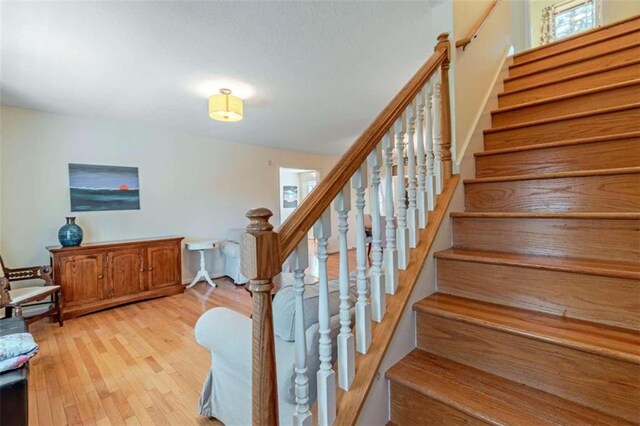 stairway with wood-type flooring