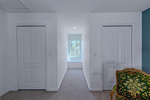 hallway with carpet floors