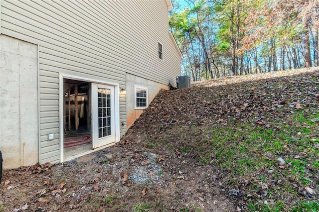 view of side of home featuring central AC