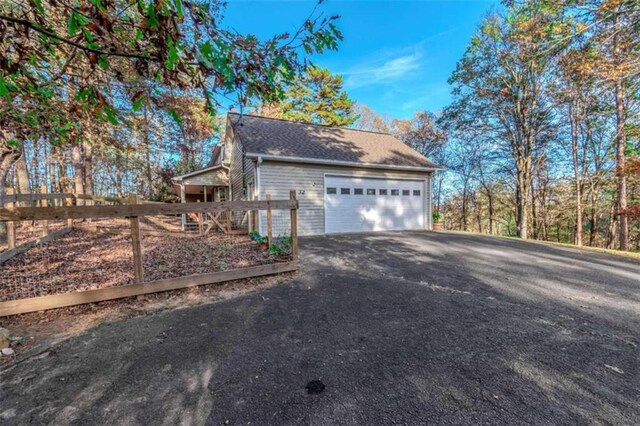 view of side of property with a garage