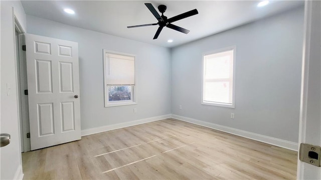 unfurnished room featuring ceiling fan and light hardwood / wood-style floors