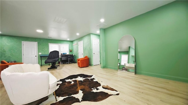 living room with light hardwood / wood-style flooring