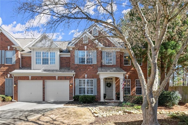 view of front of property with a garage, concrete driveway, and brick siding