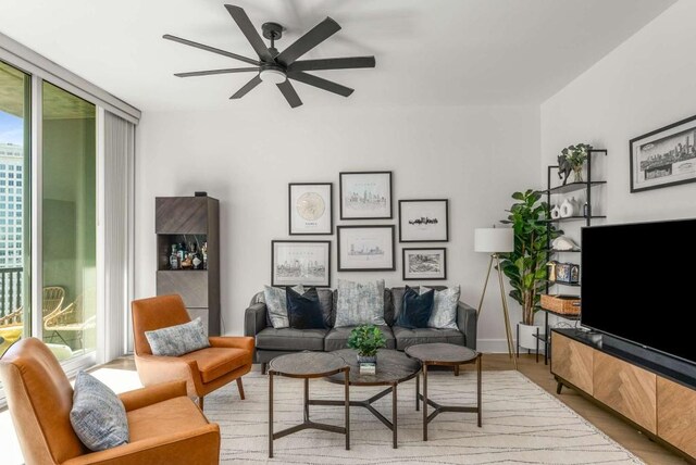 1080 Peachtree St NE Unit 1909, Atlanta, GA 30309 - living area with floor to ceiling windows, a ceiling fan, and wood finished floors