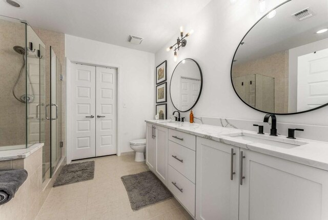 1080 Peachtree St NE Unit 1909, Atlanta, GA 30309 - bathroom with a shower stall, visible vents, and a sink