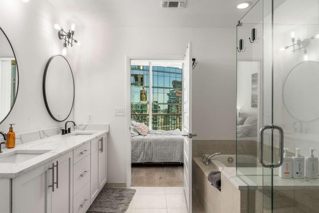 1080 Peachtree St NE Unit 1909, Atlanta, GA 30309 - bathroom featuring a sink, visible vents, and connected bathroom