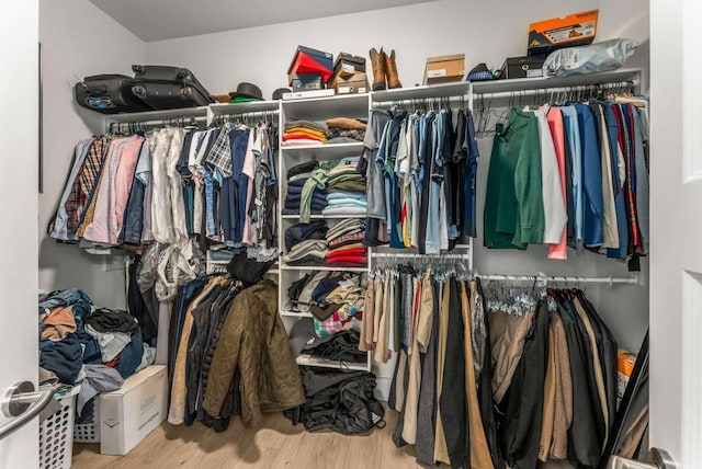 1080 Peachtree St NE Unit 1909, Atlanta, GA 30309 - walk in closet featuring wood finished floors