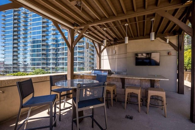 1080 Peachtree St NE Unit 1909, Atlanta, GA 30309 - view of patio / terrace with outdoor dining area, outdoor wet bar, and area for grilling