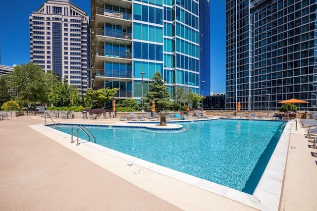 1080 Peachtree St NE Unit 1909, Atlanta, GA 30309 - community pool with a patio area and a city view