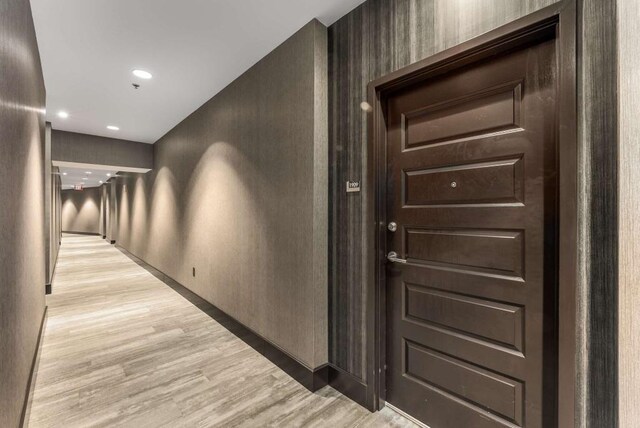 1080 Peachtree St NE Unit 1909, Atlanta, GA 30309 - hallway with recessed lighting, light wood-type flooring, and baseboards