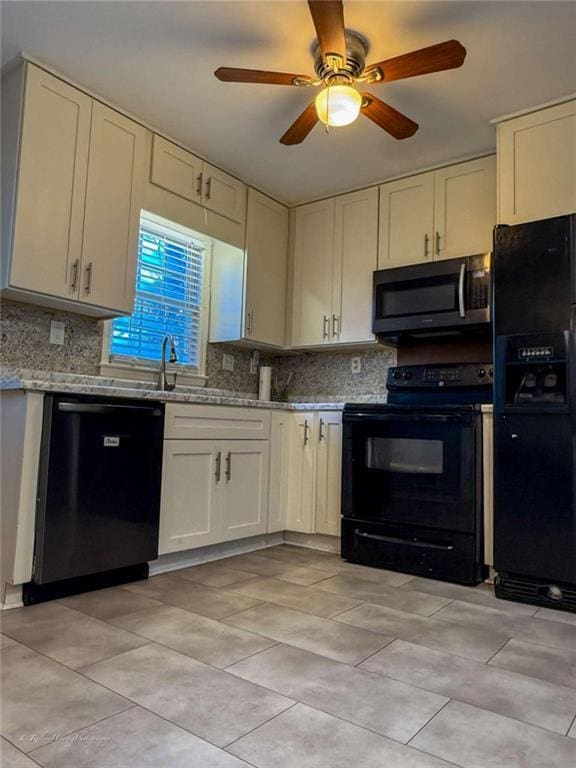 kitchen featuring light stone counters, decorative backsplash, black appliances, and ceiling fan