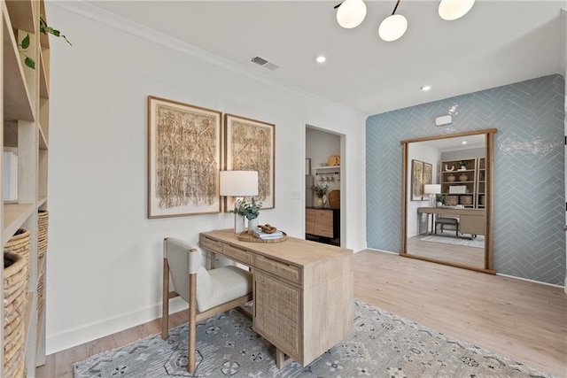 office featuring ornamental molding, light hardwood / wood-style floors, and tile walls