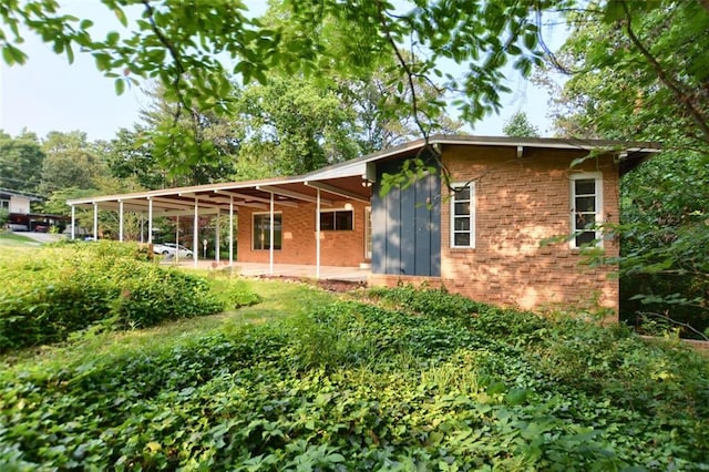 3861 Foxford Dr, Atlanta, GA 30340 - rear view of house with brick siding and a patio area