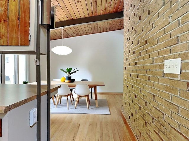 3861 Foxford Dr, Atlanta, GA 30340 - dining space featuring wood ceiling, light wood finished floors, brick wall, and baseboards